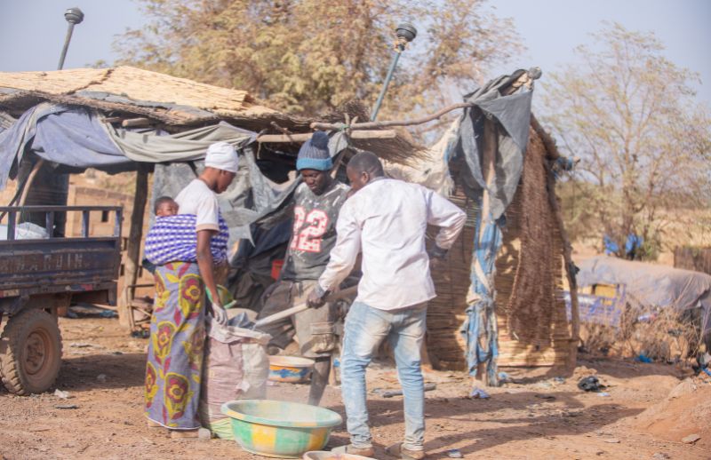 Above At the site, babies are carried by working mothers — surrounded by dust, noise, and toxic air.